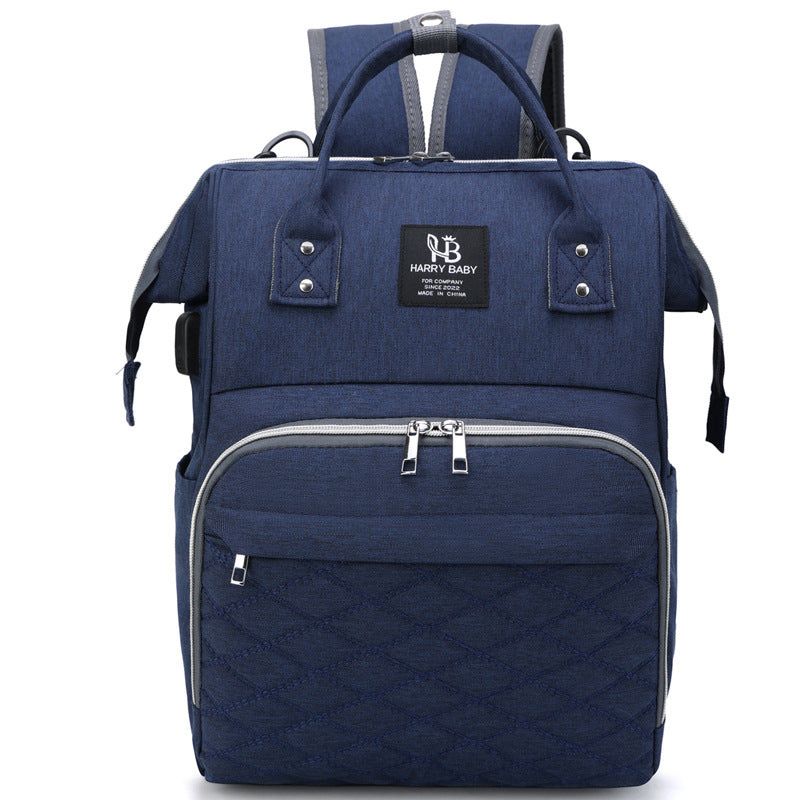 Large capacity multifunctional blue baby diaper bag with multiple compartments, double shoulder straps, and soft surface oxford material.